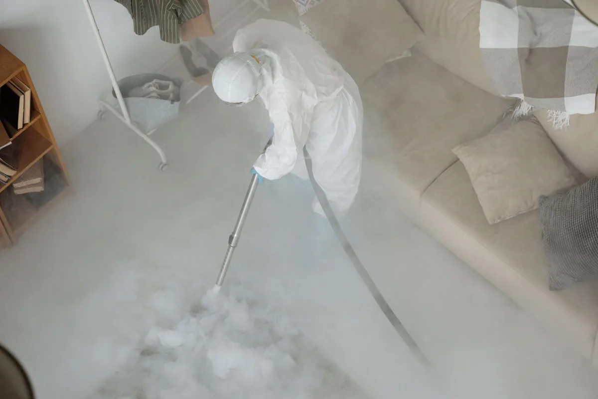 Biohazard cleanup technician in protective equipment, Wellington, UT